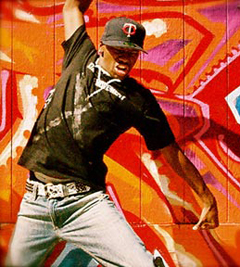 dancer in front of graffiti wall
