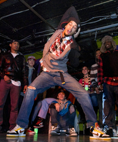 man dancing in group battle