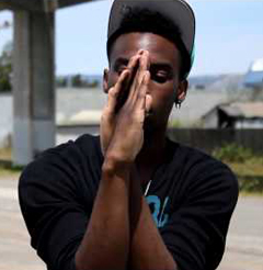 dancer crosses hands in front of him